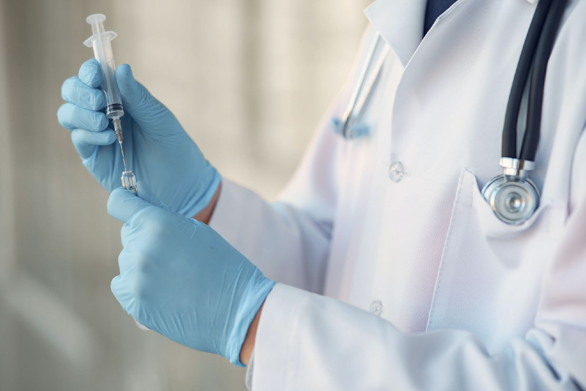 Gloved handed doctor doing transfusion 